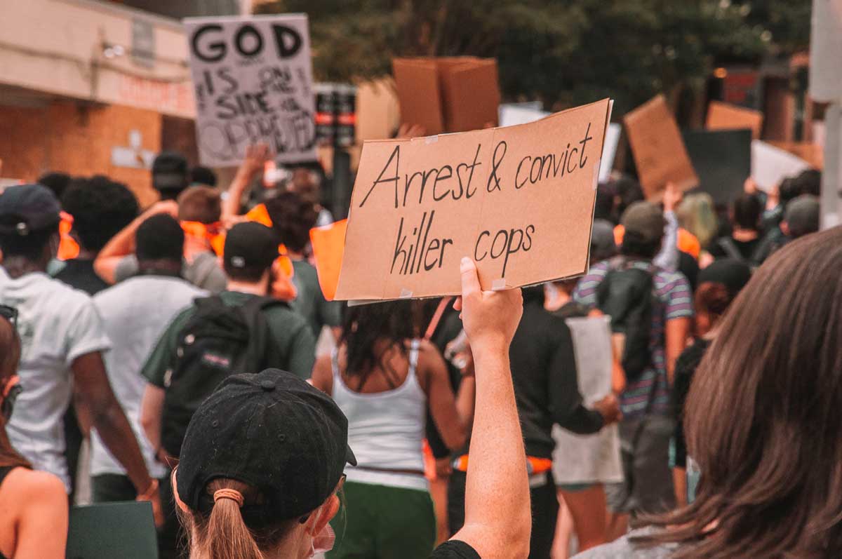 protest Ex-cop accused of catfishing teen, then killing her family in California